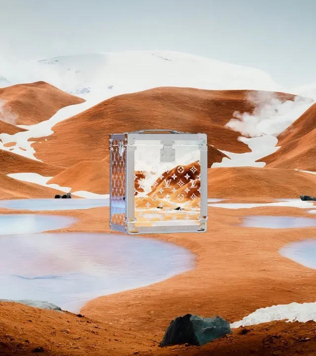 Louis Vuitton's 'VIA Treasure Trunk' NFT with hot water springs flowing from mountains in the background.