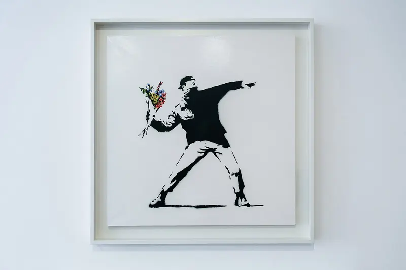 Banksy's "Love is in the Air" painting
